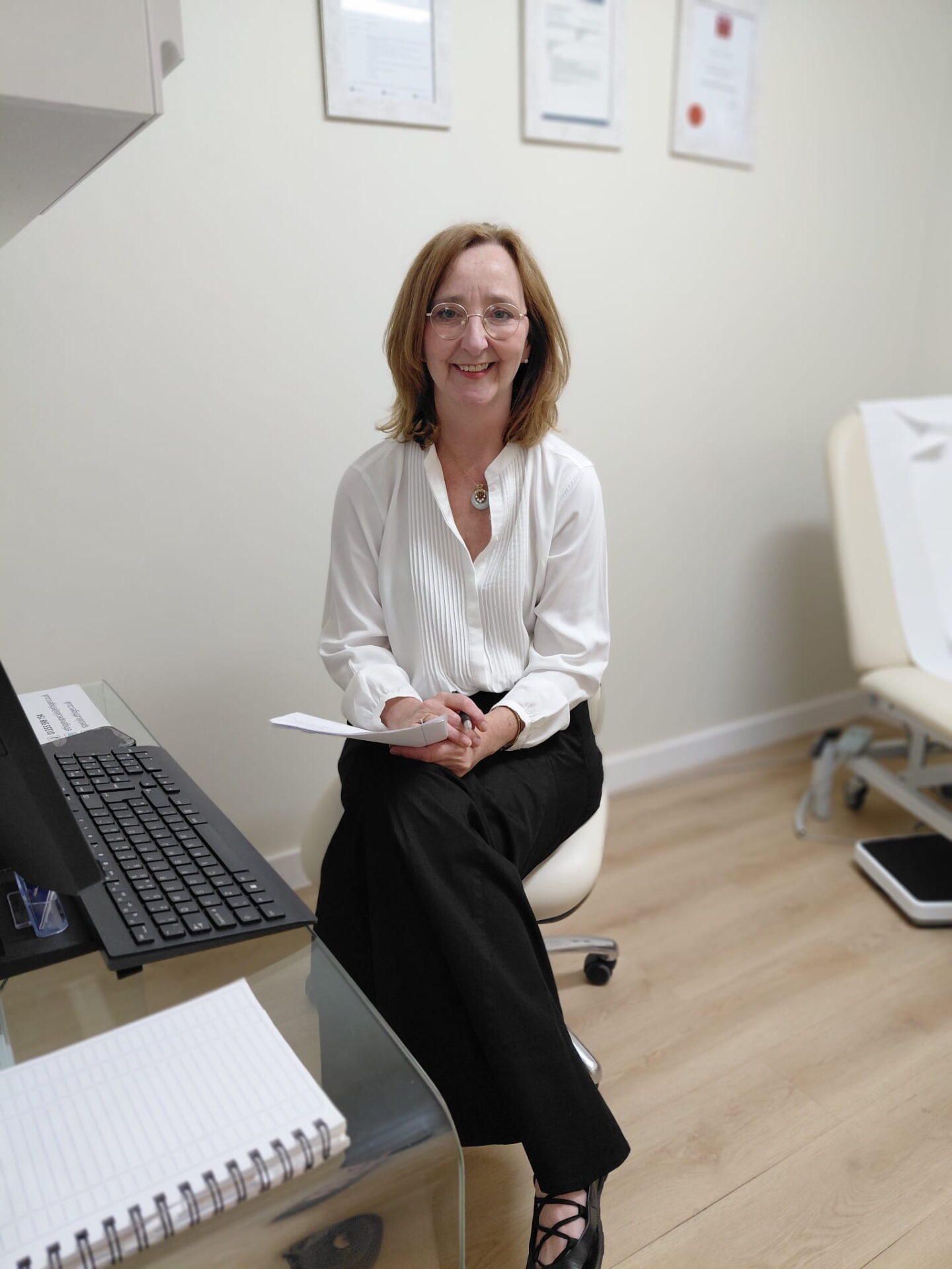 anne marie sitting at her desk, about to conduct an autism assessment