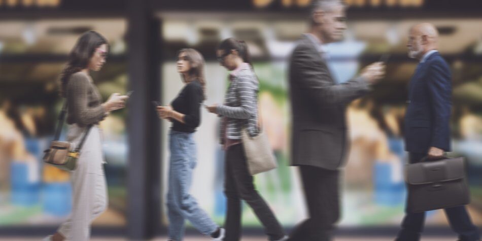 blurry image of people walking through a busy street, preparing for an autism assessment